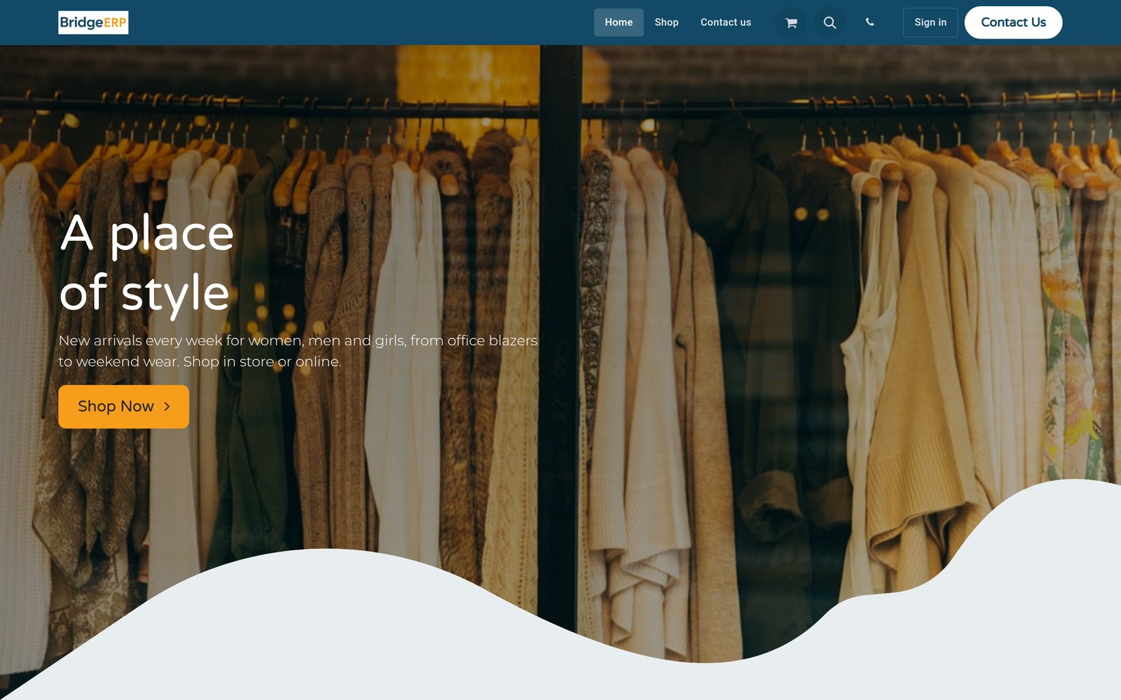 A clothing store website with a rail of clothes under the headline A place of style.